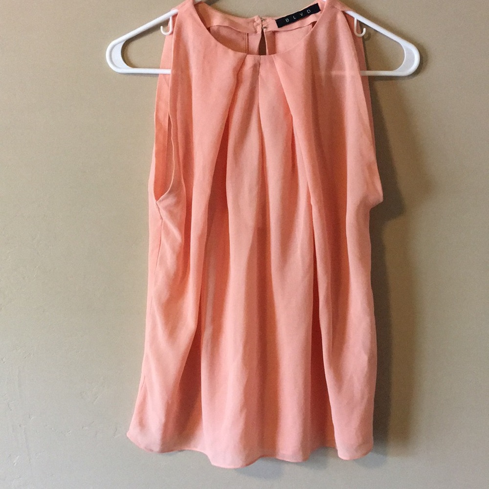 Light-colored orange blouse from BLVD